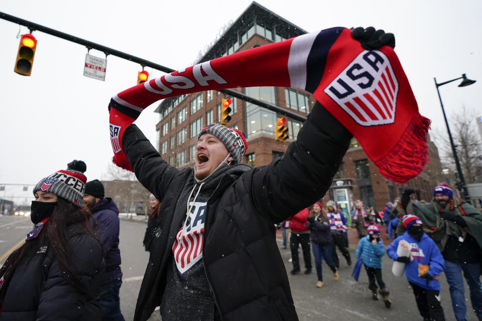 A group of United States men's national soccer team supporters march to Lower.com Field ahead of a FIFA World Cup qualifying soccer match against El Salvador, Thursday, Jan. 27, 2022, in Columbus, Ohio. (AP Photo/Julio Cortez)