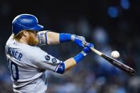 Los Angeles Dodgers' Justin Turner fouls off a pitch during the ninth inning of a baseball game against the Arizona Diamondbacks, Sunday, Sept. 26, 2021, in Phoenix. (AP Photo/Ross D. Franklin)