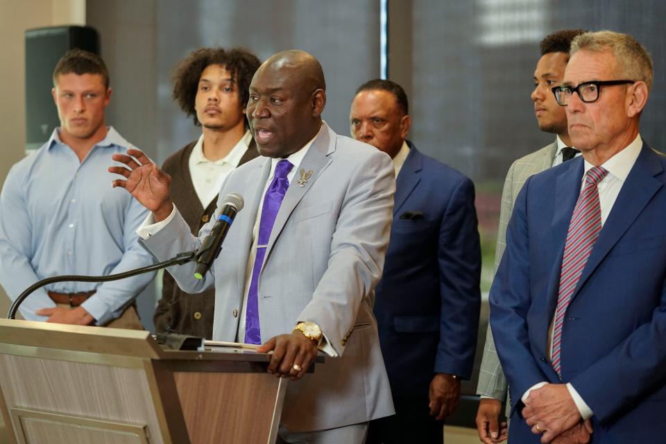 Standing with former Northwestern athletes, attorney Ben Crump speaks during a news conference addressing widespread hazing accusations at the university.