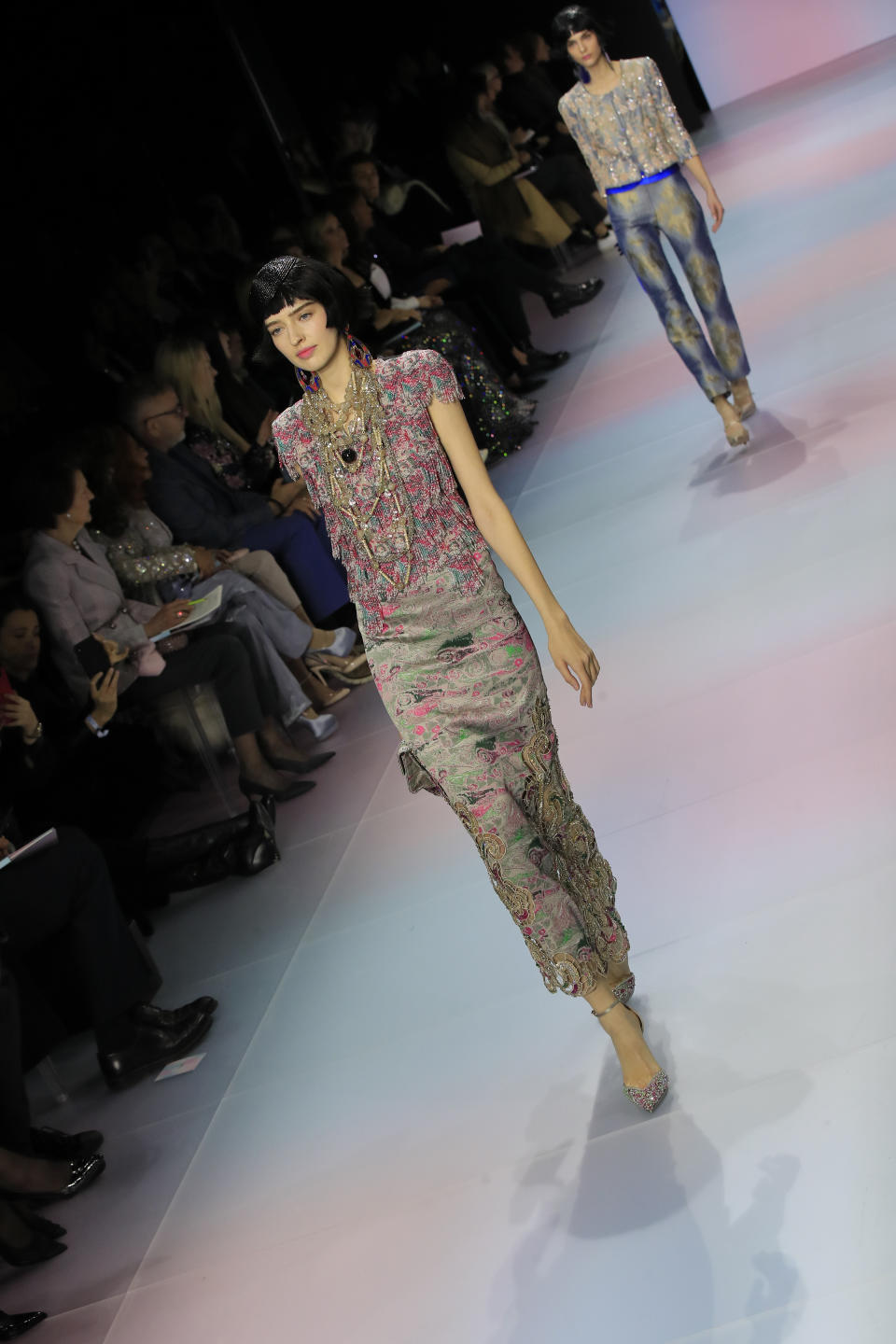 A model wears a creation for the Armani Prive Haute Couture Spring/Summer 2020 fashion collection presented Tuesday Jan. 21, 2020 in Paris. (AP Photo/Michel Euler)