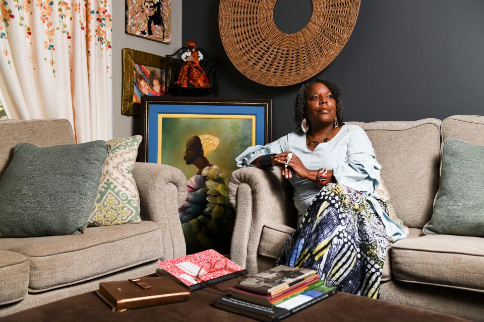 Glenis Redmond, Greenville's first poet laureate, poses for a portrait in her living room where does most of her writing on Wednesday, Aug. 9, 2023.