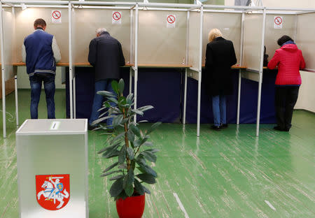 People make their choise during the first round of Lithuanian Presidential election in Vilnius, Lithuania May 12, 2019. REUTERS/Ints Kalnins