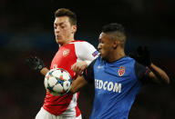 Football - Arsenal v AS Monaco - UEFA Champions League Second Round First Leg - Emirates Stadium, London, England - 25/2/15 Arsenal's Mesut Ozil in action with Monaco's Fortuna Wallace Santos Action Images via Reuters / John Sibley Livepic EDITORIAL USE ONLY.