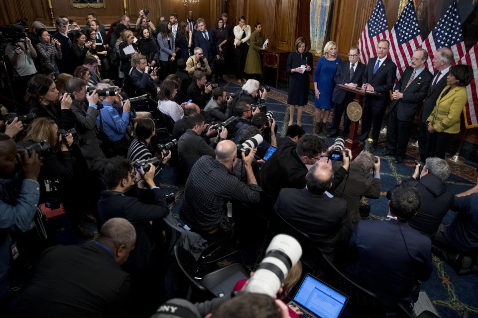 House Intelligence Committee Chairman Adam Schiff, D-Calif., fourth from right, accompanied by from left, House Speaker Nancy Pelosi of Calif., House Committee on Oversight and Reform Chairwoman Carolyn Maloney, D-N.Y., House Judiciary Committee Chairman Jerrold Nadler, D-N.Y., House Foreign Affairs Committee Chairman Eliot Engel, D-N.Y., House Ways and Means Committee Chairman Richard Neal, D-Mass., and House Financial Services Committee Chairwoman Maxine Waters, D-Calif., speaks at a news conference after the House votes to impeach President Donald Trump, Wednesday, Dec. 18, 2019, on Capitol Hill in Washington. (AP Photo/Andrew Harnik)