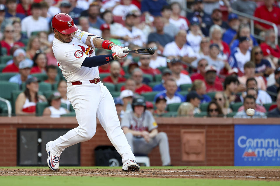 St. Louis Cardinals' Wilson Contreras hits an RBI single during the third inning of a baseball game against the Atlanta Braves, Monday, June 24, 2024, in St. Louis. (AP Photo/Scott Kane)