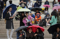 <p>People gather in front of Buckingham Palace in London, Thursday, Sept. 8, 2022. Buckingham Palace says Queen Elizabeth II has been placed under medical supervision because doctors are "concerned for Her Majesty's health." Members of the royal family traveled to Scotland to be with the 96-year-old monarch. (AP Photo/Frank Augstein)</p> 