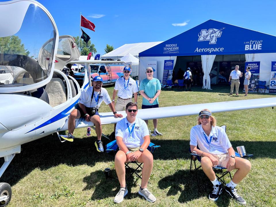 MTSU Aerospace Department representatives staff the university’s exhibition tent, which included one of its Diamond training aircraft, this week for the 2022 EAA AirVenture in Oshkosh, Wis.