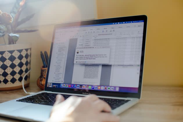 Professor Audrey Truschke shows some of the hate mail she has received at her home on Monday afternoon. (Photo: Natalie Keyssar for HuffPost)