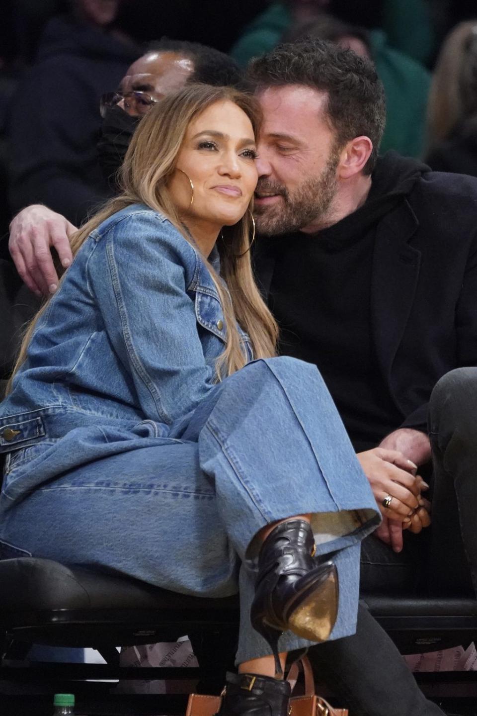 Jennifer Lopez and Ben Affleck attend the Los Angeles Lakers and Boston Celtics game on Tuesday, Dec. 7, 2021. - Credit: (AP Photo/Marcio Jose Sanchez)