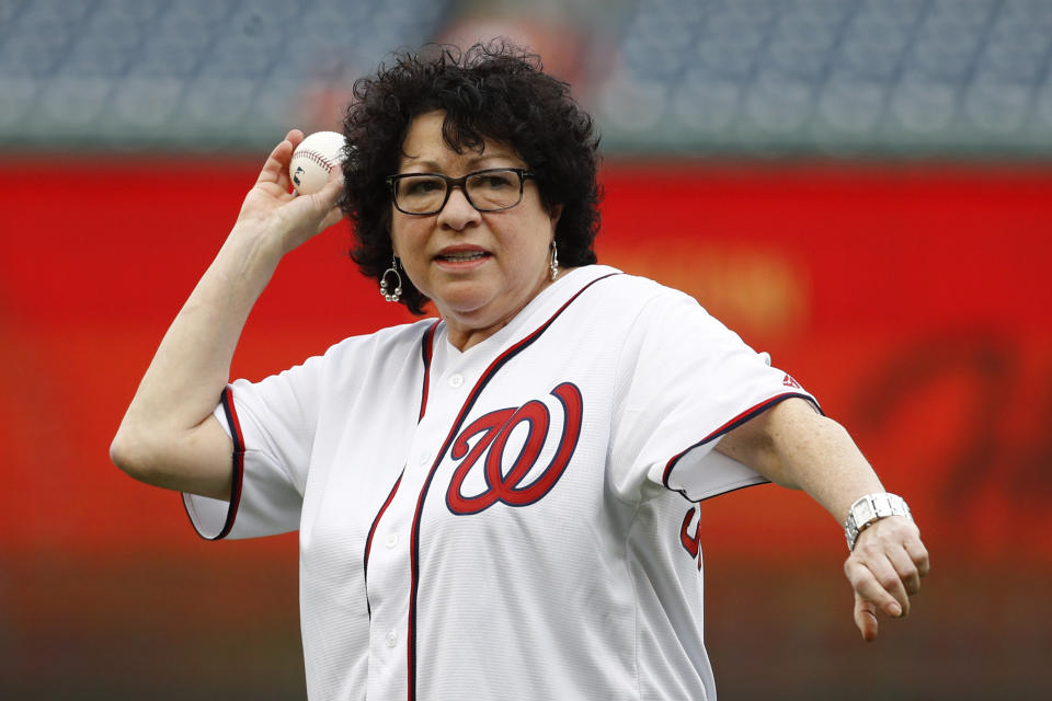 Supreme Court Associate Justice Sonia Sotomayor throws out a ceremonial first pitch before a baseball game between the Philadelphia Phillies and the Washington Nationals, Thursday, Sept. 26, 2019, in Washington. (AP Photo/Patrick Semansky)