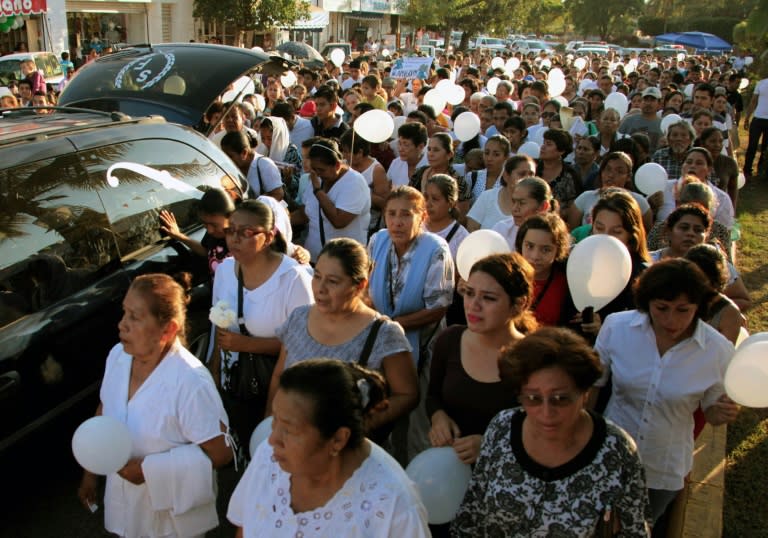 Mourners at the funeral of priest Gregorio Lopez in Altamirano