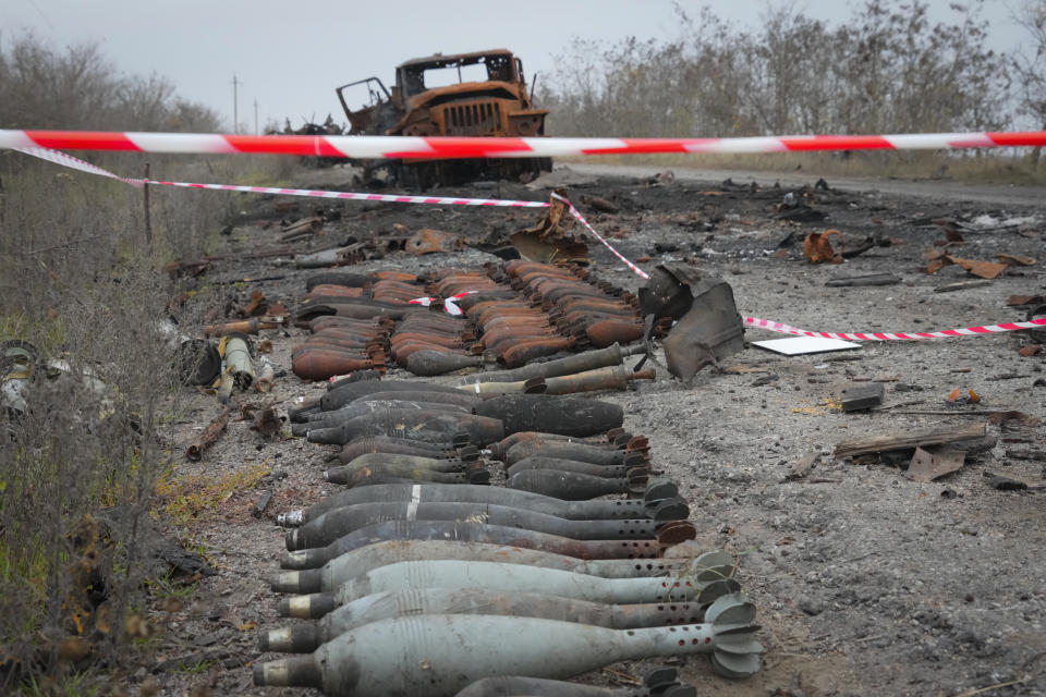 A burnt military car lies by the road after heavy battles between Ukrainian troops and Russian invaders in Mykolayiv region, Ukraine, Saturday, Nov. 12, 2022.(AP Photo/Efrem Lukatsky)