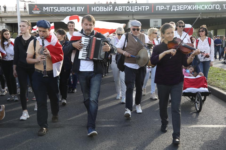 A group of musicians attend a Belarusian opposition supporters' rally protesting the official presidential election results in Minsk, Belarus, Sunday, Sept. 13, 2020. Protests calling for the Belarusian president's resignation have broken out daily since the Aug. 9 presidential election that officials say handed him a sixth term in office. (TUT.by via AP)