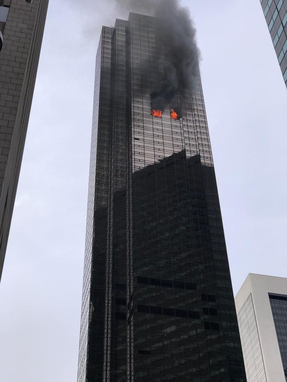 Smoke rises from the 50th floor of Trump Tower in Manhattan on April 7. (Photo: Muhammed Said Tani/Anadolu Agency via Getty Images)