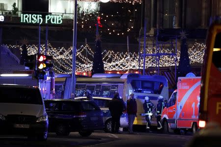 Police stand near the Christmas market in Berlin, Germany December 19, 2016. REUTERS/Pawel Kopczynski