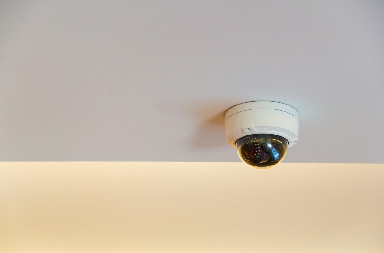 360 angle security camera on white ceiling