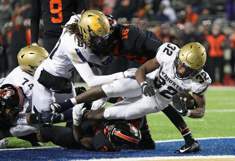 Hoban running back Lamar Sperling dives into the end zone to score against Massillon during the second half of an OHSAA Division II state semifinal, Friday, Nov. 25, 2022, in Akron.