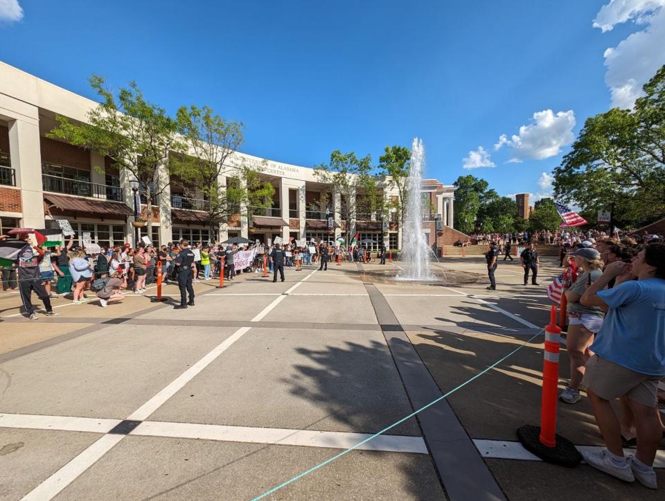 Demonstrators gathered Wednesday afternoon to express solidarity with Palestine in the University of Alabama's Student Center plaza. Loose ropes separated the nearly 300 demonstrators from a counter-demonstration across the plaza.