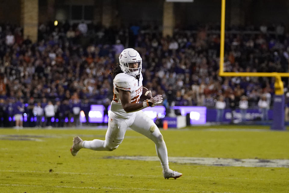 Texas running back Jonathon Brooks runs free before scoring a touchdown against TCU during the first half of an NCAA college football game, Saturday, Nov. 11, 2023, in Fort Worth, Texas. (AP Photo/Julio Cortez)