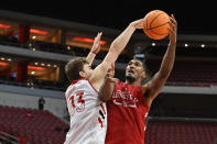 Louisville forward Matt Cross, left, attempts to block the shot of forward Malik Williams (5) during an NCAA college basketball intrasquad scrimmage in Louisville, Ky., Saturday, Oct. 16, 2021. (AP Photo/Timothy D. Easley)