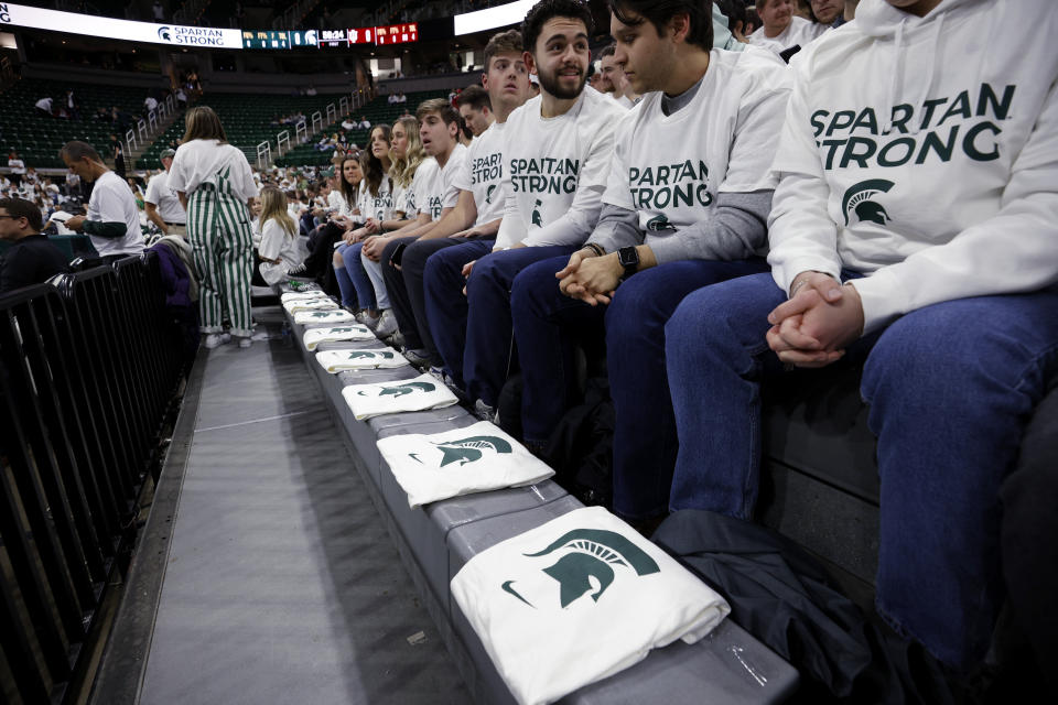 T-shirts are placed in the front row of the Breslin Center for the three killed and five injured Michigan State students before an NCAA college basketball game between Indiana and Michigan State on Tuesday, Feb. 21, 2023, in East Lansing, Mich. (AP Photo/Al Goldis)