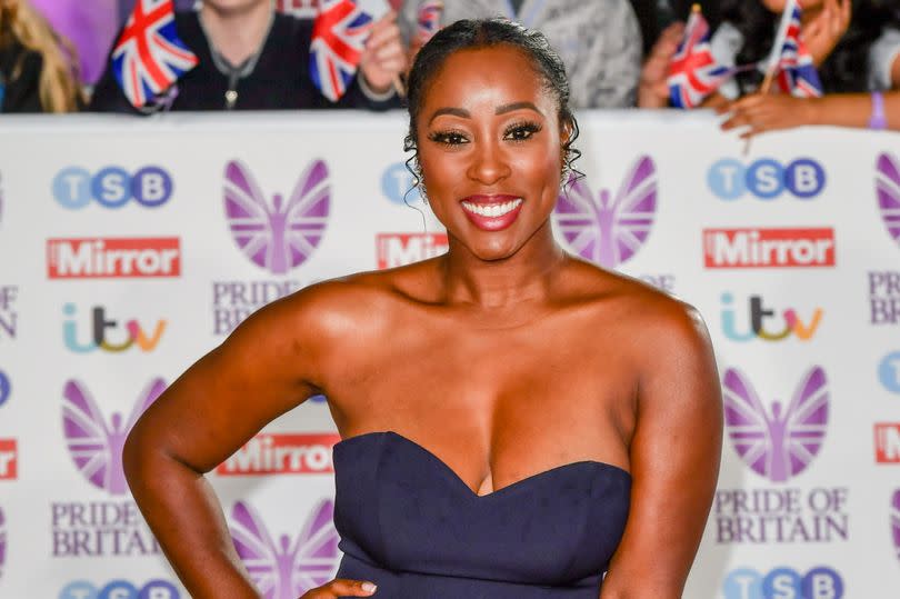 Scarlette Douglas smiles on red carped at Pride of Britain awards