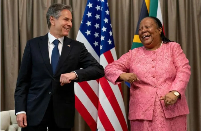 Anthony Blinken and Naledi Pandor giving each other an elbow bump