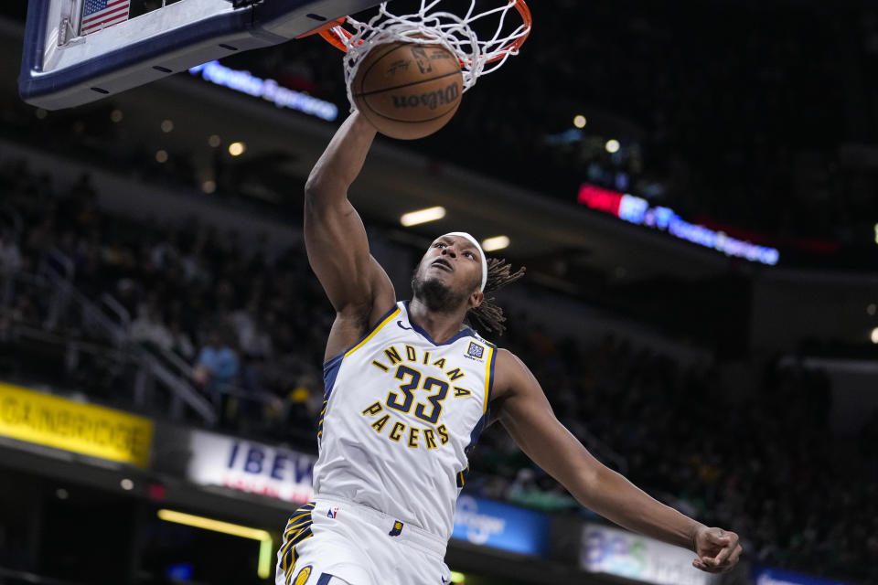 Indiana Pacers center Myles Turner (33) gets a basket on a dunk against the Boston Celtics during the first half of an NBA basketball game in Indianapolis, Monday, Jan. 8, 2024. (AP Photo/Michael Conroy)