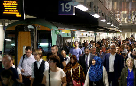 FILE PHOTO: Passengers disembark a Southern train at Victoria Station in London, Britain August 8, 2016. REUTERS/Neil Hall/File Photo