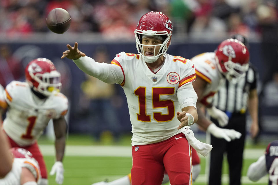Kansas City Chiefs quarterback Patrick Mahomes (15) throws against the Houston Texans during the first half of an NFL football game Sunday, Dec. 18, 2022, in Houston. (AP Photo/David J. Phillip)