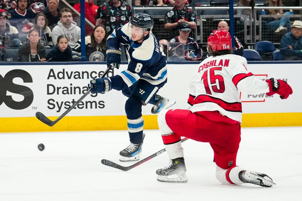 Apr 16, 2024; Columbus, Ohio, USA; Columbus Blue Jackets defenseman Zach Werenski (8) scores a goal past Carolina Hurricanes defenseman Jack Drury (15) during the third period of the NHL hockey game at Nationwide Arena.