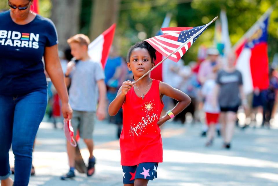 Brenna Alston, 6, marches in the Watts-Hillandale neighborhood’s 72nd annual Fourth of July parade in Durham, N.C, Sunday, July 4, 2021.