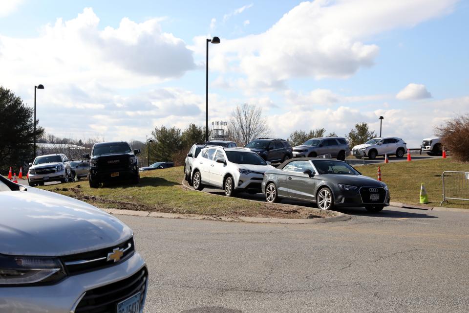 Cars park on the grass and ramps of the parking garage at Westchester County Airport Jan. 27, 2023. 
