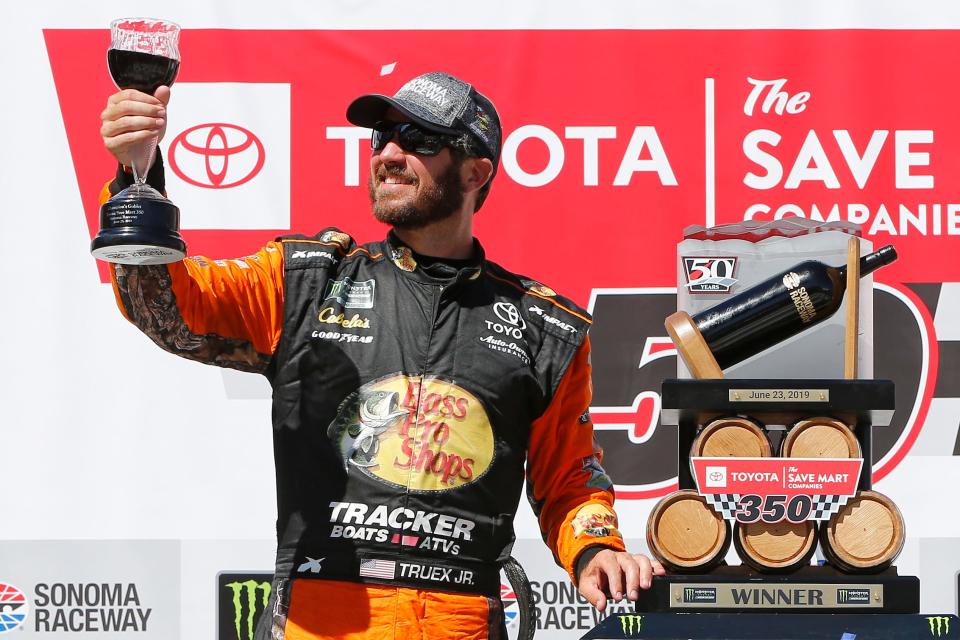 Martin Truex Jr. celebrates in victory lane after winning the 2019 Toyota/Save Mart 350 at Sonoma Raceway.