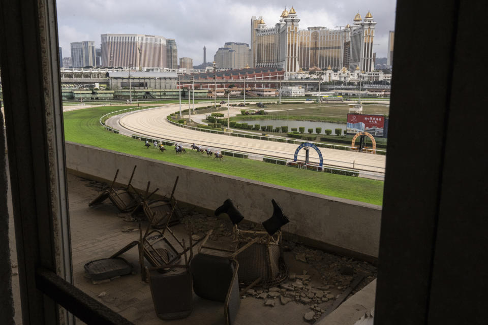 Abandoned tribunes as jockeys compete in last Macao races at the Macao Jockey Club in Macao, Saturday, March 30, 2024. After more than 40 years, Macao’s horse racing track hosted its final races on Saturday, bringing an end to the sport in the city famous for its massive casinos. (AP Photo/Louise Delmotte)