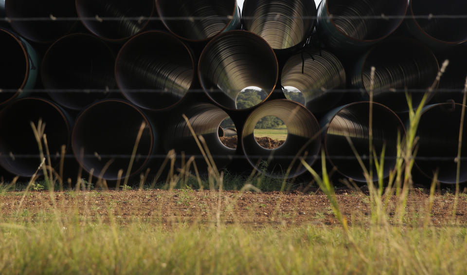 Pipes for a proposed new natural gas pipeline that would pass through the Texas Hill Country are staged near Blanco, Texas Friday, Aug. 2, 2019. A proposed pipeline is a 430-mile, $2 billion natural gas expressway that pipeline giant Kinder Morgan has mapped from the booming West Texas oil patch to Houston. (AP Photo/Eric Gay)