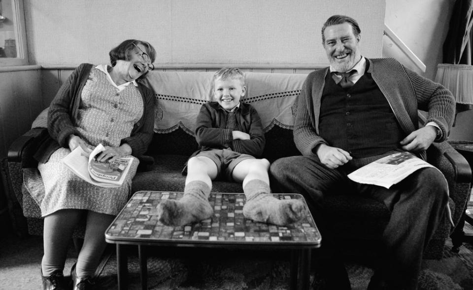 Buddy, centre, with his grandparents, played by Judi Dench and Ciarán Hinds (Rob Youngson / Focus Features)