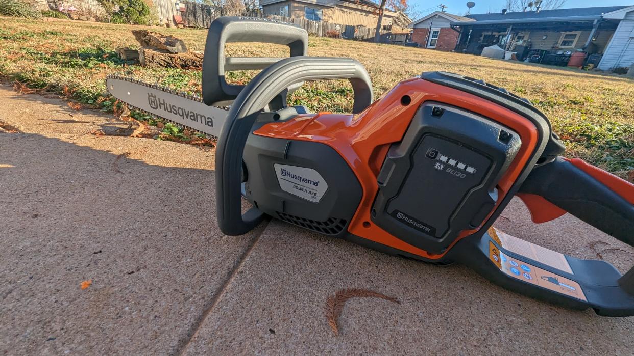  Hero image of the Husqvarna Power Axe 350i Cordless Electric Chainsaw. 