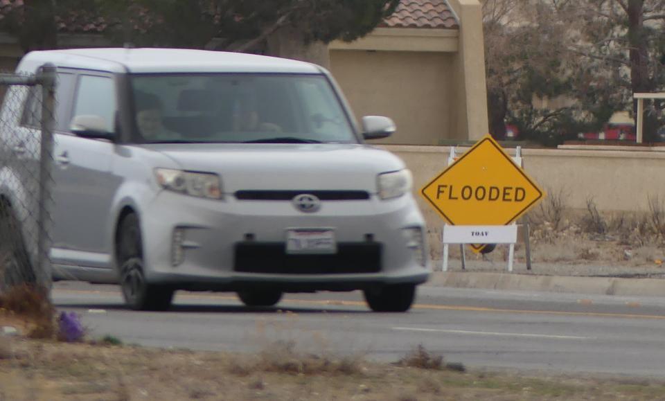 Anticipating heavy rain showers from an approaching storm, the Town of Apple Valley on Wednesday placed several road safety signs in areas prone to flooding.