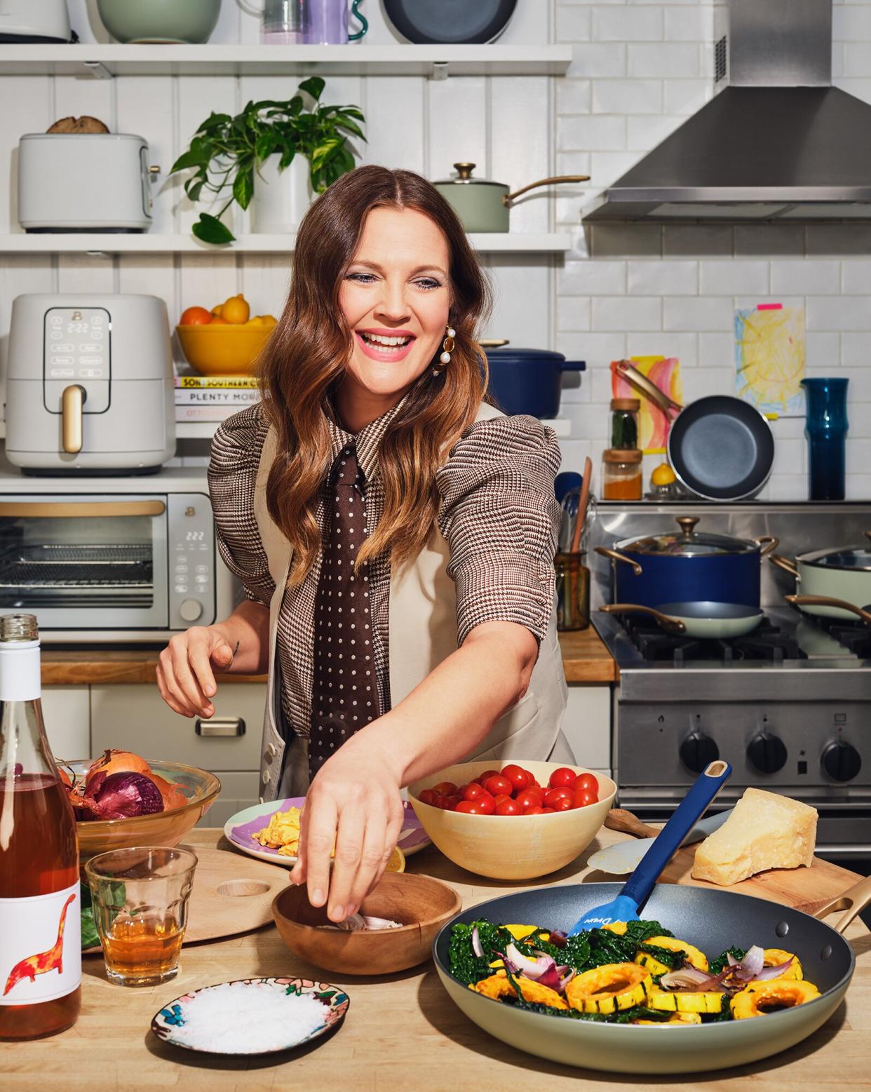 Portrait of Drew Barrymore cooking in a kitchen
