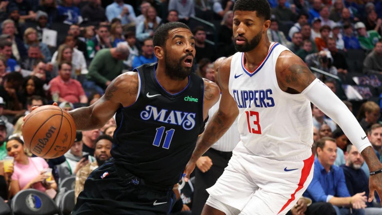 <div>DALLAS, TEXAS - NOVEMBER 10: Kyrie Irving #11 of the Dallas Mavericks drives the ball past Paul George #13 of the LA Clippers in the first half during the NBA In-Season Tournament at American Airlines Center on November 10, 2023 in Dallas, Texas. (Photo by Richard Rodriguez/Getty Images)</div>