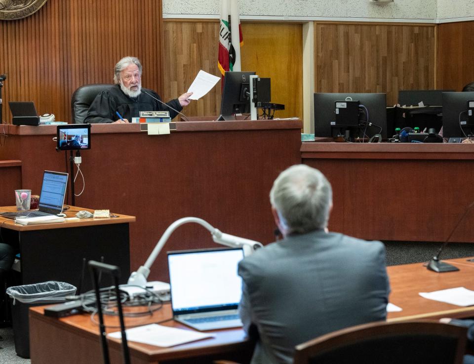 Judge Michael Sheltzer conducts a hearing in Tulare County Superior Court on Friday, February 9, 2024 for the former Healthcare Conglomerate Associates' CEO Dr. Yorai “Benny” Benzeevi, left, and his attorney Nina Marino via Zoom.