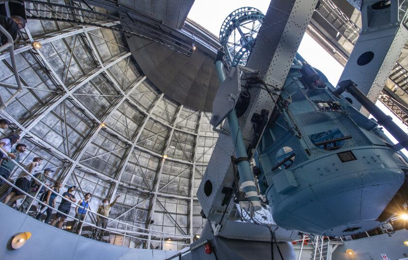 LOS ANGELES, CA-SEPTEMBER 23, 2023:Docent Tim Thompson, right, gives students from USC a tour inside the Mount Wilson Observatory where the famous 100 inch Hooker telescope, right, is located. October 5 marks the 100th anniversary of Astronomer Edwin Hubble's famous discovery that our galaxy is only one of countless in a vast universe. Hubble made this discovery by using the Hooker telescope. (Mel Melcon / Los Angeles Times)