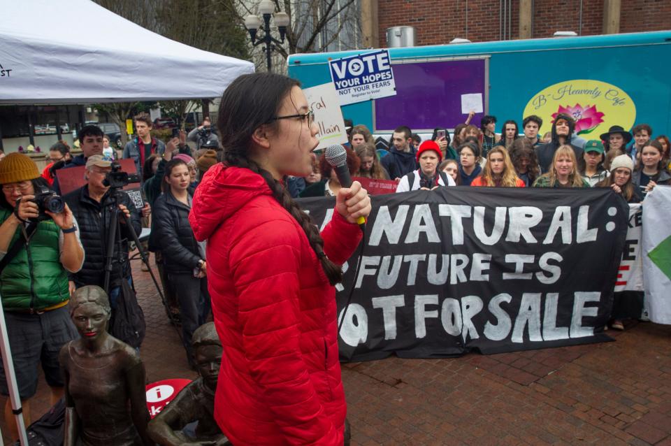 South Eugene student Milla Vogelezang-Liu speaks during a protest of NW Natural's backing of an effort to roll back the gas ban in Eugene.