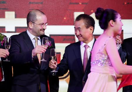 FIBA Secretary General Patrick Baumann and Wang Jianlin (R), chairman of the Wanda Group, attend a signing ceremony in Beijing, China June 16, 2016. REUTERS/Jason Lee