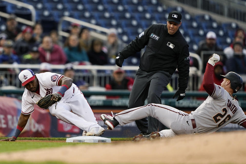 Arizona Diamondbacks' Pavin Smith is forced out by Washington Nationals third baseman Maikel Franco on a ball hit by Carson Kelly during the second inning in the second game of a baseball doubleheader at Nationals Park, Tuesday, April 19, 2022, in Washington. (AP Photo/Alex Brandon)