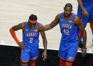 Oklahoma City Thunder guard Shai Gilgeous-Alexander (2) and Al Horford (42) deject after a foul was called on Gilgeous-Alexander during the second half of an NBA basketball game on Thursday, March 18, 2021, in Atlanta. (AP Photo/Brynn Anderson)