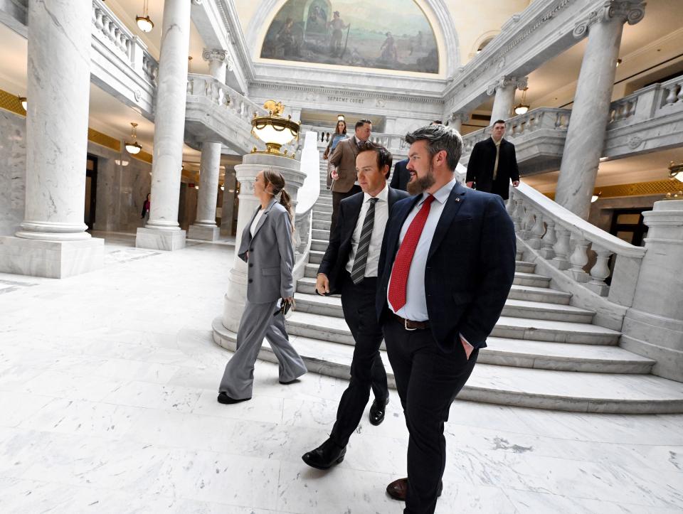 Utah Jazz owner Ryan Smith, center, and his wife Ashley Smith, left, exit the Capitol with Mike Maughan after attending the Senate as as the SJR12 resolution on bringing an NHL hockey franchise to Utah was voted on at the Capitol in Salt Lake City on Monday, Jan. 29, 2024. | Scott G Winterton, Deseret News