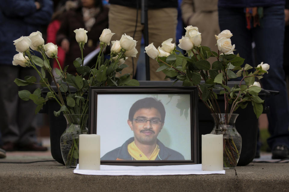 A picture of Srinivas Kuchibhotla, an immigrant from India who was recently shot and killed in Kansas, is surrounded by roses during a vigil in honor of him at Crossroads Park in Bellevue, Washington, U.S. March 5, 2017.&nbsp; (Photo: David Ryder / Reuters)