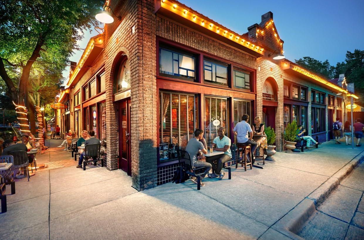 a group of people sitting outside a building